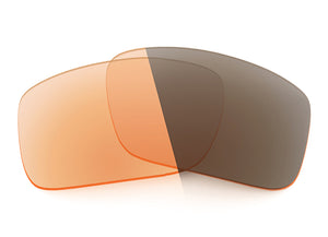 Two Adapt Orange Photochromic Sunglass lenses laid on top of each other.
