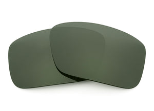 Two Gray Green Sunglass lenses laid on top of each other.